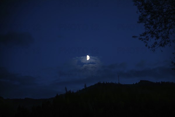 Moon over a range of hills, Mugel mountain, Leoben, Styria, Austria, Europe