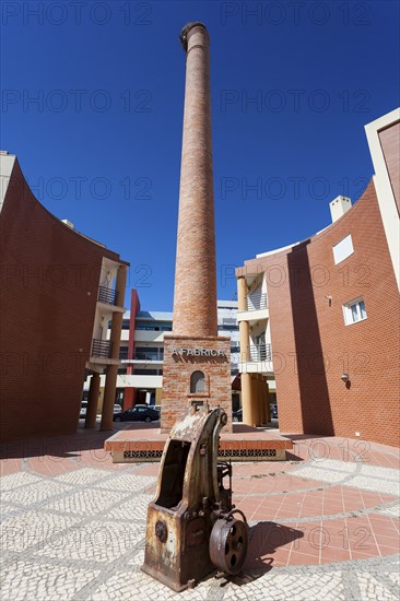 Chimney of industry in Portimao, Algarve, Portugal, Europe