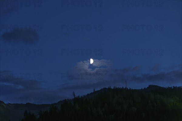 Moon over a range of hills, Mugel mountain, Leoben, Styria, Austria, Europe