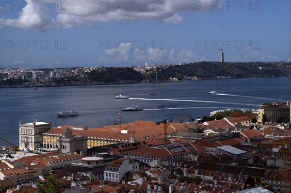 View from Castelo de São Jorge to old town, city view, river Rio Tejo with ferries, ferry boats,