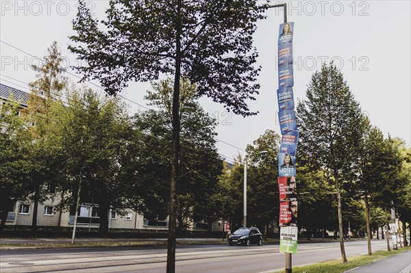 Election posters hanging from a lamppost, taken in Dresden, 31 August 2024. A new state parliament