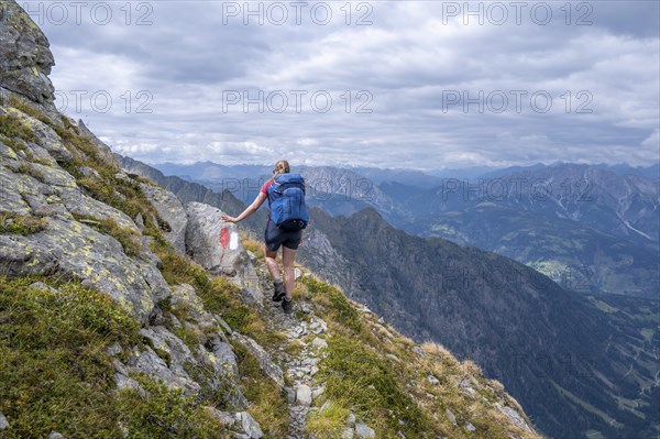 Hiker on the Carnic High Trail, ascent to the Raudenspitze, Carnic Main Ridge, Carnic Alps,