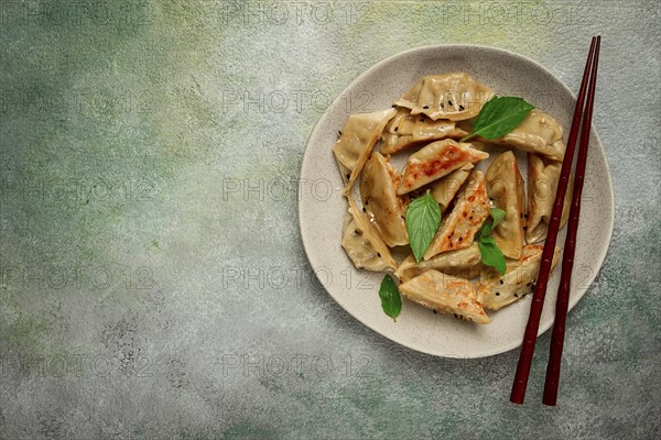 Japanese fried dumplings, gyoza, sesame seeds, top view, no people