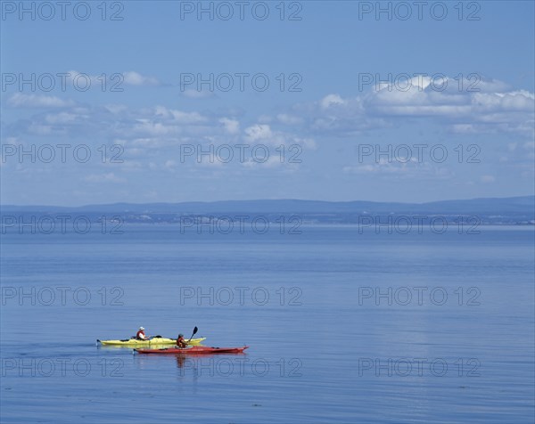 Sea Kayakers on Saint-Lawrence River in summer, Port-au-Persil, Charlevoix, Quebec, Canada, North