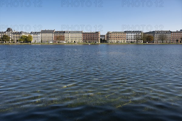 Historic buildings on the waterfront under a blue sky, Søerne, Sortedams Sø, Copenhagen Lakes,