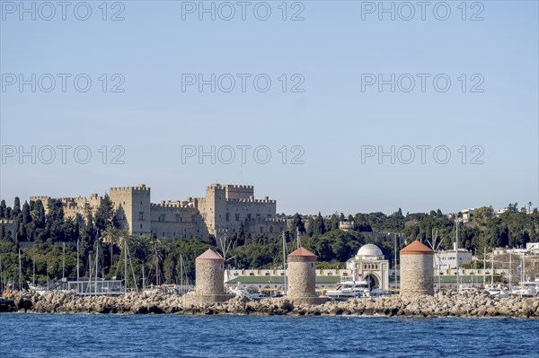 Exit from the harbour, view of the Grand Master's Palace and the three windmills, Rhodes,