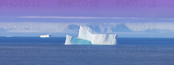 Iceberg seen from cruise ship vacation near Greenland coast in Arctic circle near Ilulissat Disko