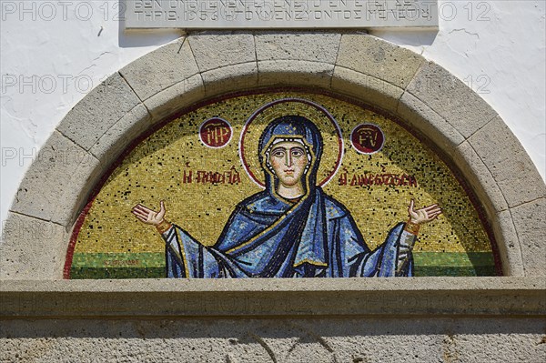 Cross-domed church of Diasososuan, close-up of a mosaic depicting Mary with outstretched arms, set