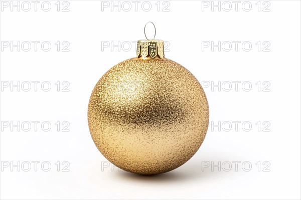 Single golden Christmas bauble ornament on white background. Generative Ai, AI generated