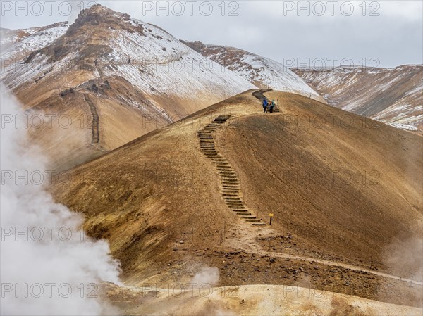 Steaming hot springs and colourful rhyolite mountains, hiking path, Hveradalir geothermal area,
