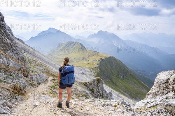 Hiker on the ascent to the Great Kinigat, Carnic Main Ridge, Carnic High Trail, Carnic Alps,