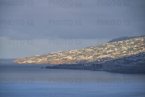 View of Funchal city and Madeira airport in the morning. Madeira, Portugal, Europe