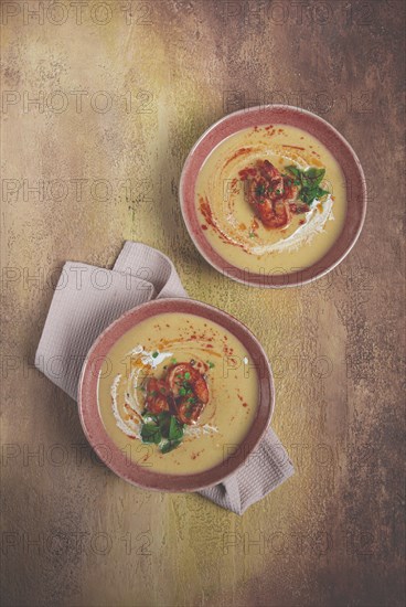 Pumpkin cream soup with shrimp, herbs and spices, homemade, no people