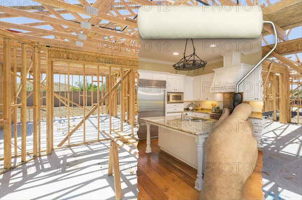 Before and after of man painting roller over construction framing to reveal completed and new