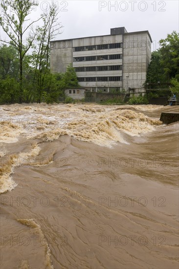 Symbolic image extreme weather, global warming, climate change, flood, flooded weir in Remseck an