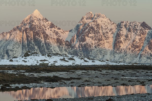 Rugged mountains, Lofoten island Vestvågøya at the fjord Gimsøystraumen, Lofoten, Northern Norway,
