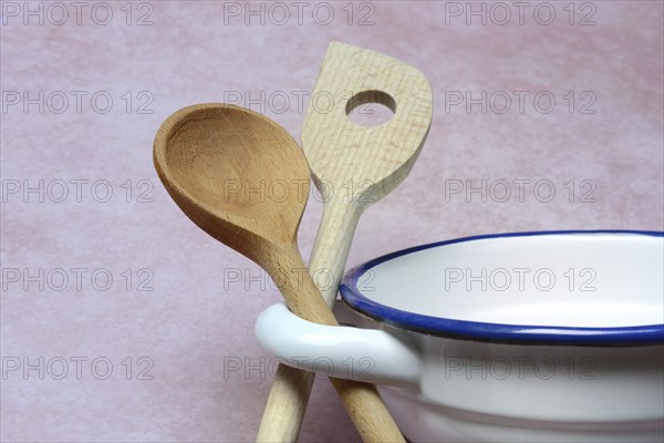 Cooking spoon on saucepan handle