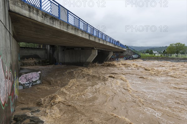 Symbolic image extreme weather, global warming, climate change, barrier, flood protection, bridge,