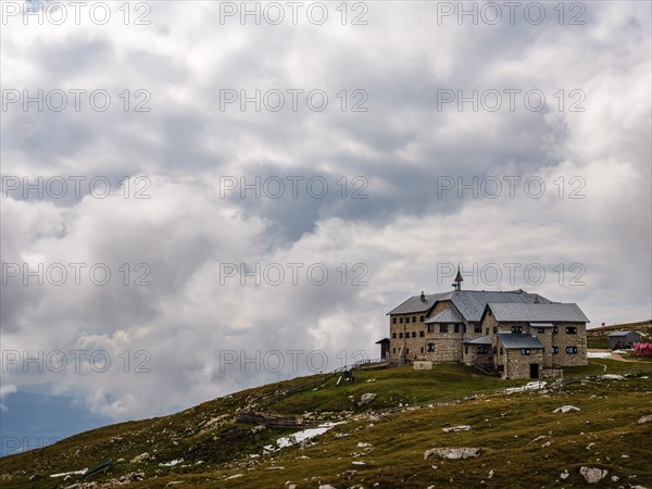 Sciliar House under a cloudy sky, Dolomites, Sciliar, South Tyrol, Italy, Europe