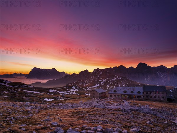 Schlernhaus at dawn, Sassolungo Group and Catinaccio behind, Dolomites, Sciliar, South Tyrol,