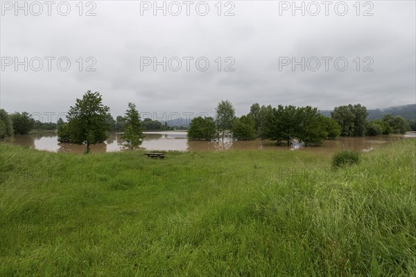 Symbolic image extreme weather, global warming, climate change, flood retention basin, flood