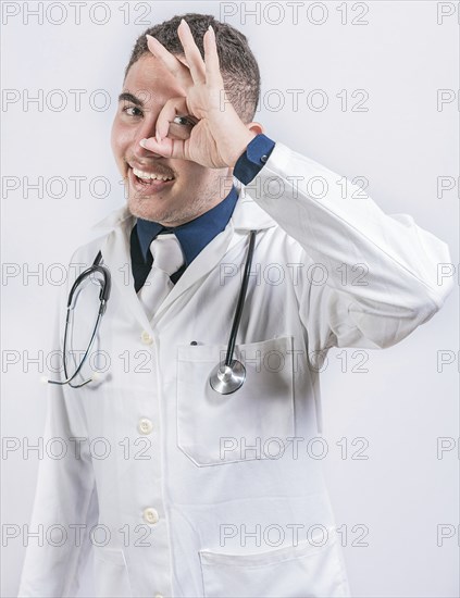 Cheerful doctor gesturing approval isolated. Latin doctor approving on isolated background,