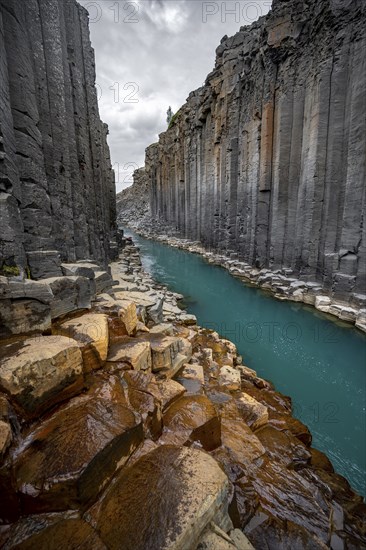 Stuðlagil Canyon, turquoise river between basalt columns, Egilsstadir, Iceland, Europe