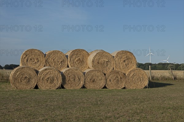 Stack of round bales, straw, wind turbines, agriculture, Allerstorf, Marlow, Mecklenburg-Western