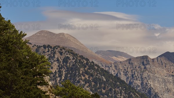 Entrance to the gorge, entrance, Xyloskalo, blue sky, grey-white clouds, Samaria gorge, Omalos,