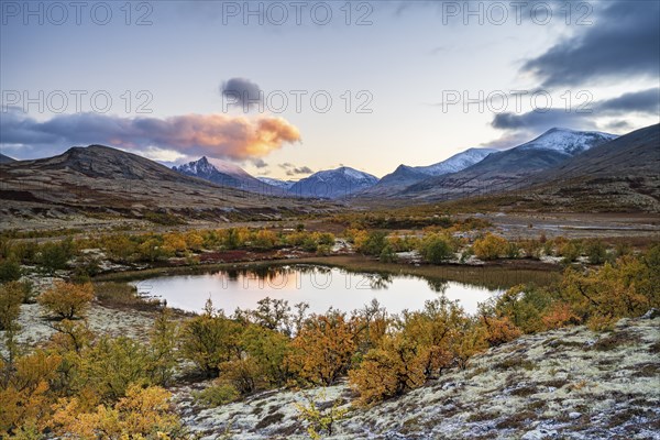 Mountains and lake in autumnal mountain landscape, Rondane National Park, Norway, Europe