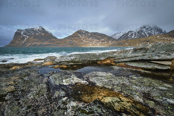 Rocky coast of fjord of Norwegian sea in winter. Lofoten islands, Norway, Europe