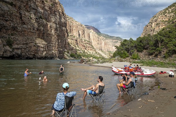 Dinosaur, Colorado, River rafters on the Green River in Dinosaur National Monument relax in the