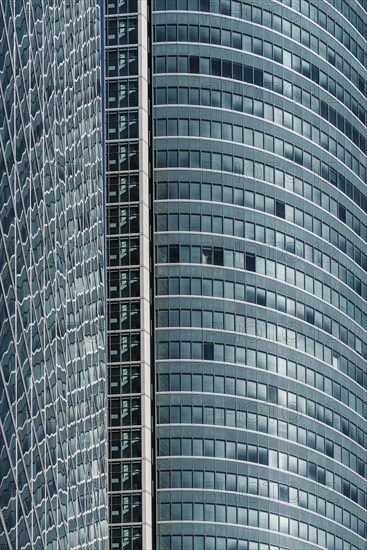 Madrid, Spain, February 7, 2021: Full frame of glass facade of skyscraper in Cuatro Torres