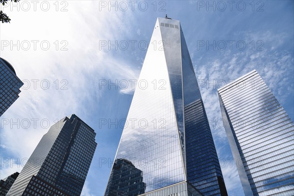 New York City, USA, June 20, 2018: One World Trade Center and other skyscrapers against blue sky in
