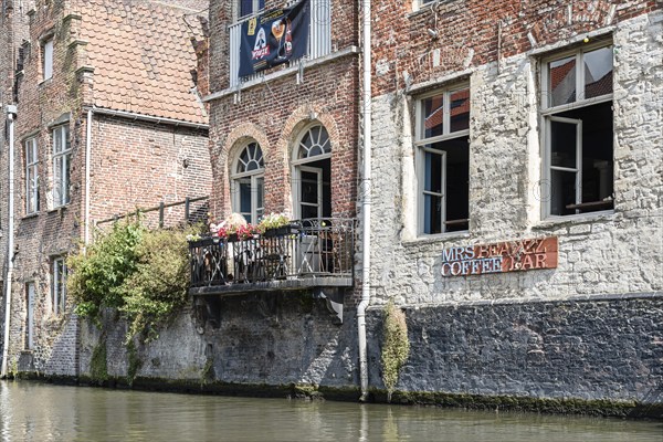 Ghent, Belgium, July 31, 2016: People sitting on a restaurant terrace in Embankment Graslei in the