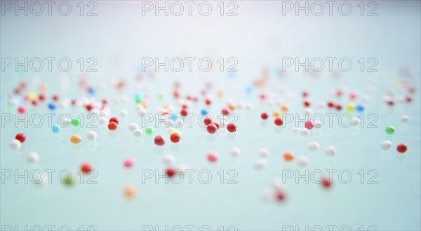 Colourful nonpareils, sugar pearls, sprinkle decorations in bright colours, mini sugar balls for