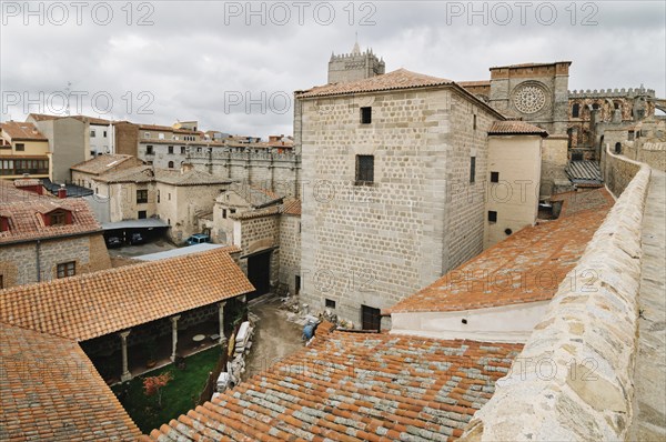 Avila, Spain, November 11, 2014: The Medieval Walls of Avila and the cathedral. Cloudy day. The old