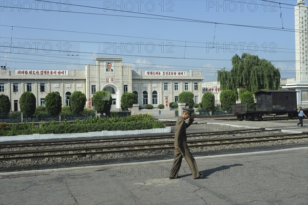 07.08.2012, Democratic People's Republic of Korea, Asia, A soldier walks along a railway platform