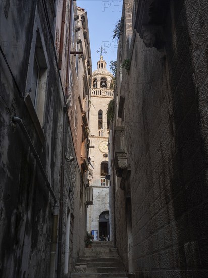 Narrow alley in the old town and church tower, Old Town of Korcula, Dalmatia, Croatia, Europe