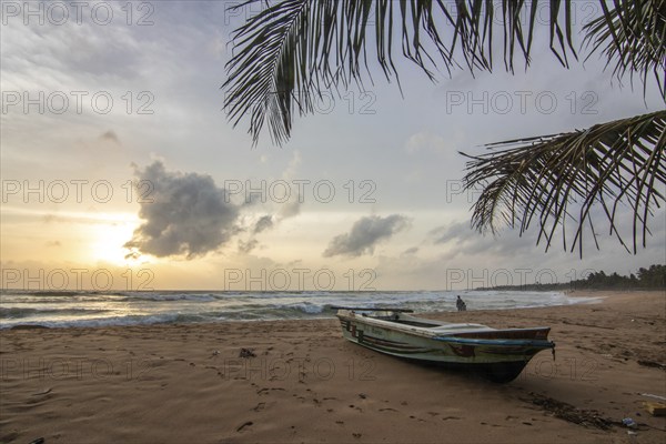 Landscape by the sea and sandy beach. A boat lies in the sand and adds a special touch to the