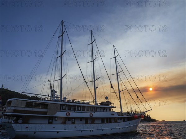 Evening atmosphere in front of sunset, sailing yacht, harbour of Korcula, island of Korcula,