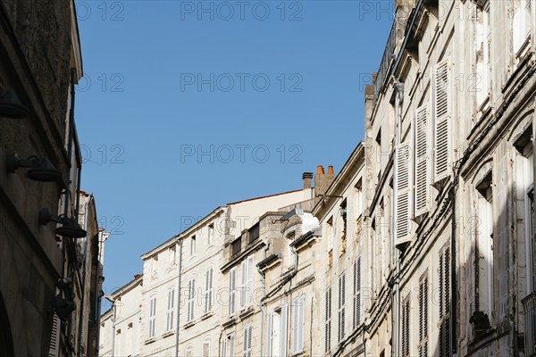 Decadent old residential buildings in the historic centre of La Rochelle, France, Europe