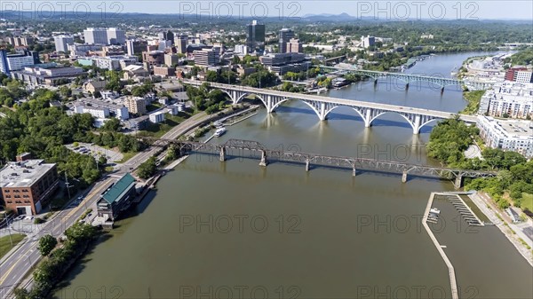 An aerial view of Knoxville, Tennessee reveals a vibrant cityscape with a mix of historic and