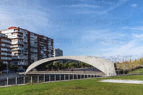 Madrid, Spain, December 9, 2019: Modern concrete bridge over Manzanares River in Madrid RIo area,