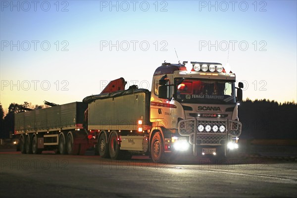 SALO, FINLAND, DECEMBER 6, 2016: Customized Scania truck of MHL-Trans with beautiful lights parked