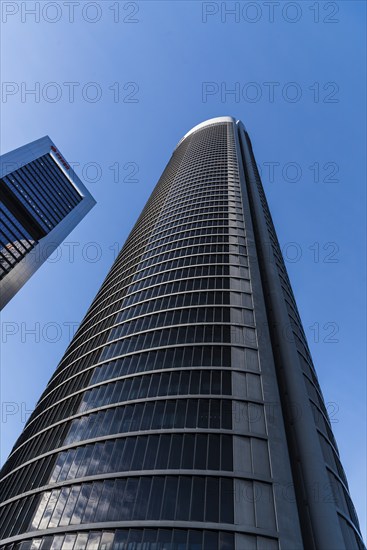 Madrid, Spain, February 7, 2021: Low angle view of skyscrapers in Cuatro Torres financial district.