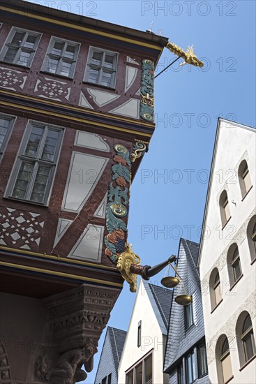 Corner detail of a colorful half timbered house, house to the Golden Libra, in the new historic old