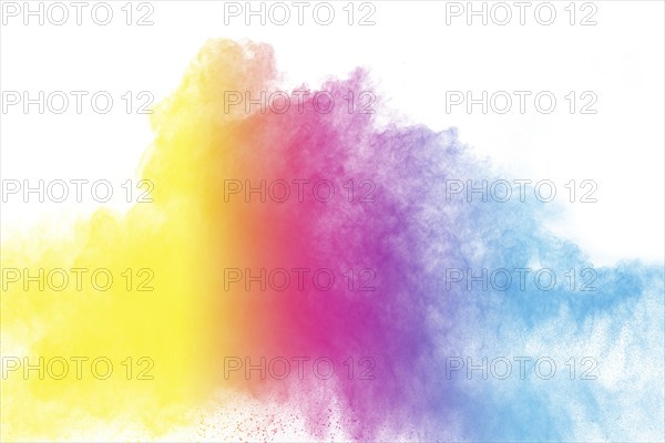 Abstract color powder explosion on white background.Freeze motion of dust splash. Painted Holi in