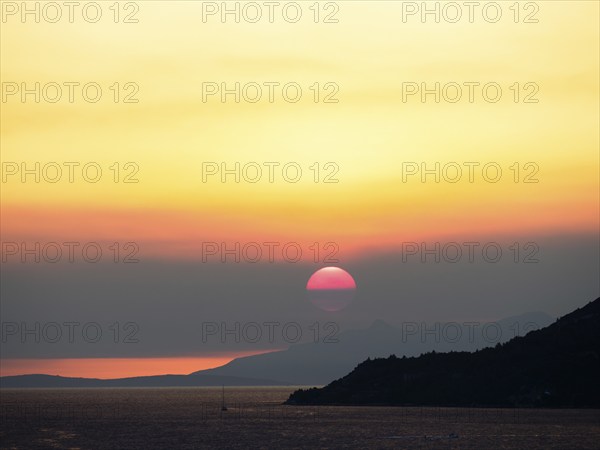 Cloudy mood at sunset by the sea, view from the bell tower, near Korcula, Korcula Island, Dalmatia,