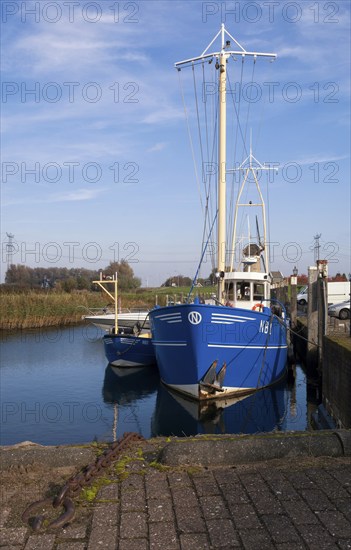 A fishing boat in the harbour of Nieuw-Beijerland on the river Spui in the Dutch region Hoeksche